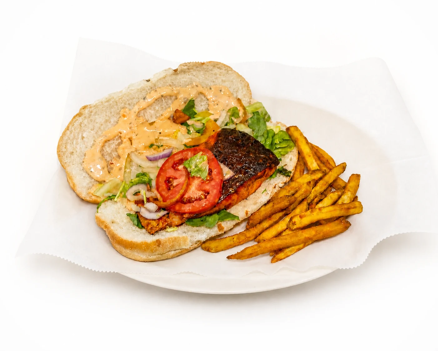 Salmon sandwich served with fries
